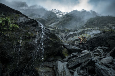 Hunter climbing mountains