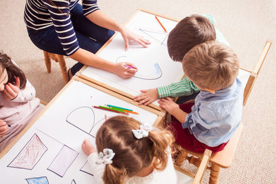High angle view of people on table