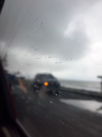 Raindrops on glass window of rainy season