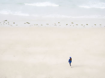 Woman walking at beach
