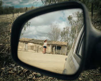 Reflection of sky on side-view mirror