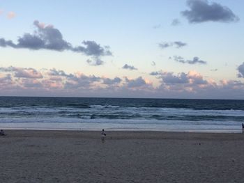 Scenic view of sea against cloudy sky