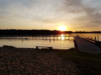 Scenic view of beach against sky during sunset