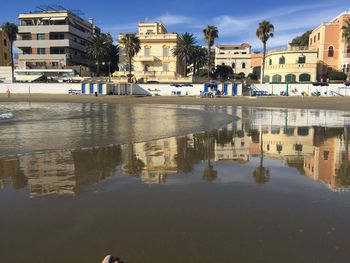 Reflection of buildings in puddle