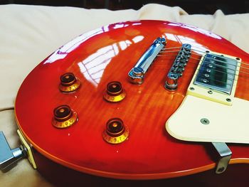 High angle view of guitar on table