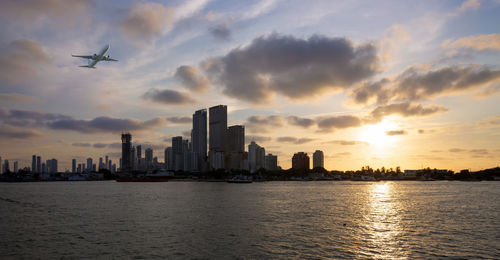 Scenic view of buildings against sky during sunset