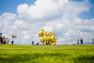 Large golden lion statue at singha park, thailand