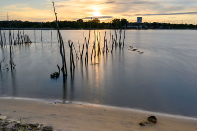 Scenic view of lake against sky during sunset