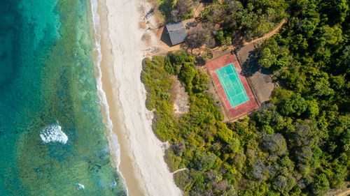 Aerial view of the tennis court next to the ocean in dar es salaam