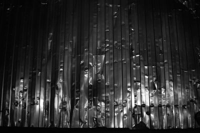 Low angle view of illuminated lanterns hanging at night