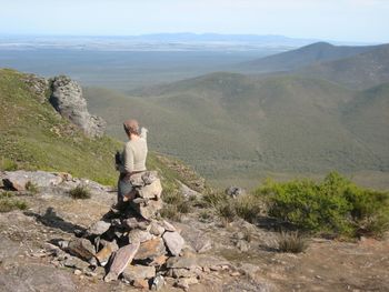 Rear view of woman standing at stirling range national park against mountains