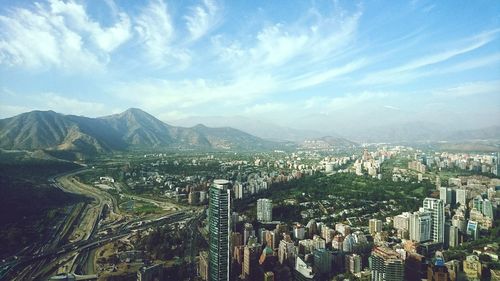 Cityscape with mountain range in background