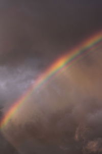 Low angle view of rainbow against sky