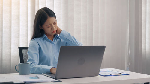 Man using laptop on table