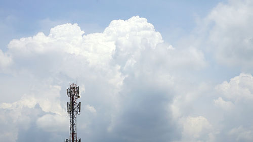 Low angle view of communications tower against sky