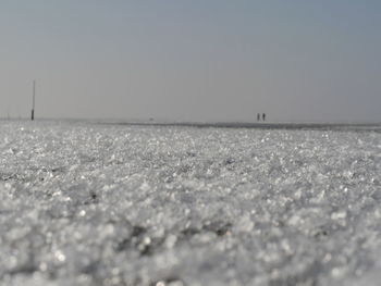 Scenic view of beach against clear sky