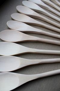 Close-up of wooden spoons on table