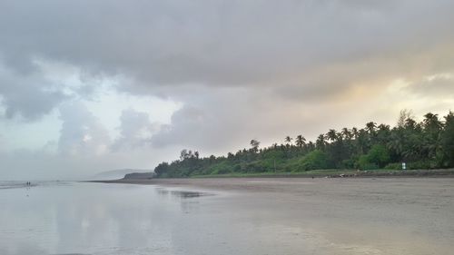 Scenic view of sea against cloudy sky