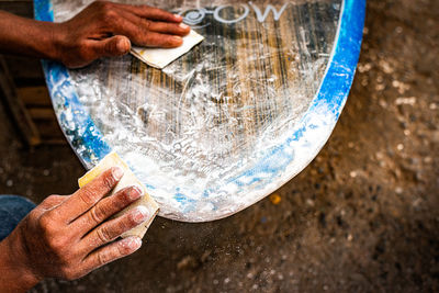 Midsection of man working in water