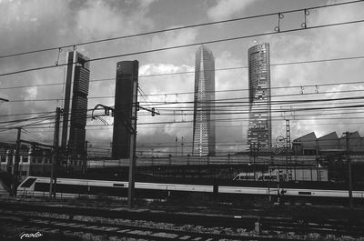 Low angle view of power lines against sky