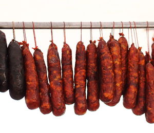 Close-up of meat hanging on barbecue grill