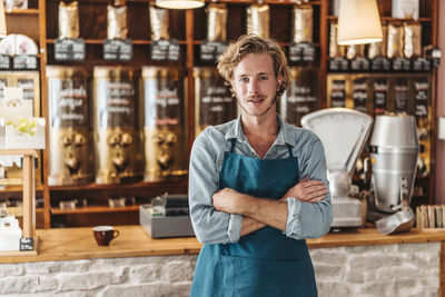 Portrait of confident coffee roaster in his shop