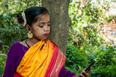 Young woman using mobile phone