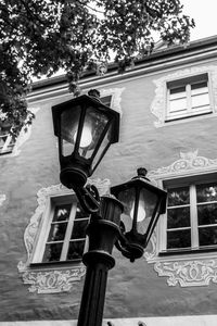 Low angle view of street light against trees