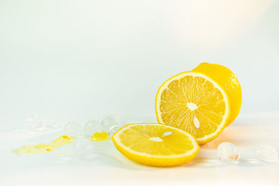 Close-up of lemon slice against white background