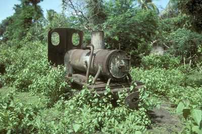 Old abandoned train on field