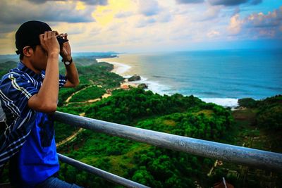 Scenic view of sea against cloudy sky