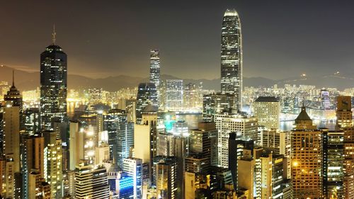 Aerial view of city lit up at night