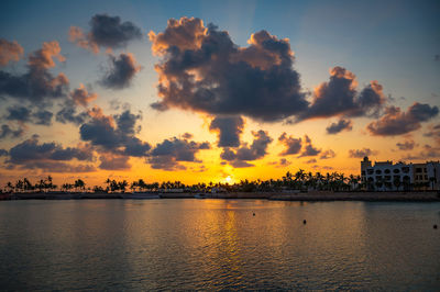 Scenic view of lake against sky during sunset