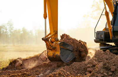 Low section of man working on field