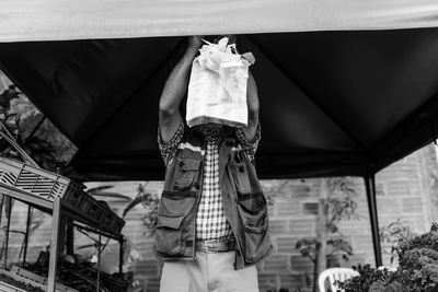 Low section of man standing outdoors