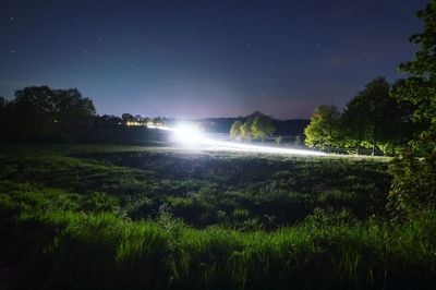Scenic view of landscape against sky at night