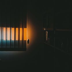 Illuminated building seen through window