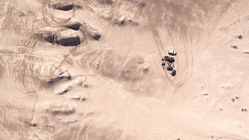 View of tire tracks in desert