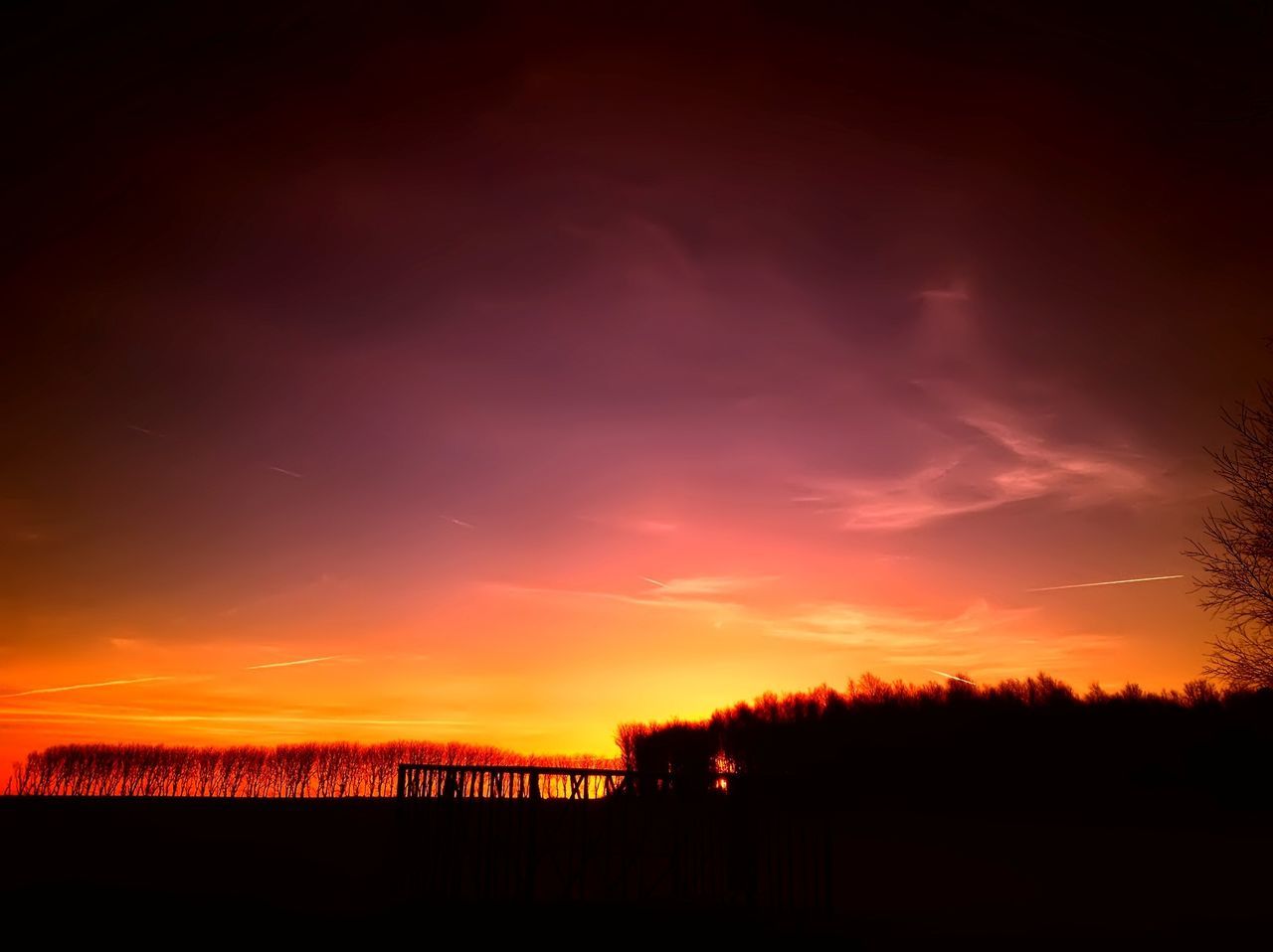 sunset, silhouette, sky, orange color, scenics, beauty in nature, tranquil scene, tranquility, tree, dark, nature, built structure, cloud - sky, idyllic, architecture, landscape, outdoors, no people, dramatic sky, dusk