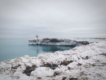 Scenic view of sea against sky during winter