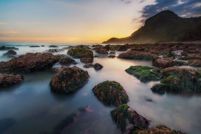 Scenic view of sea against sky at sunset