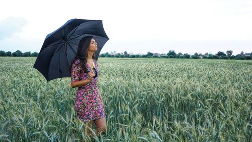 Woman standing in field