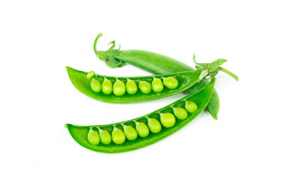 Close-up of green chili pepper against white background