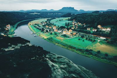 High angle view of sea and city against sky