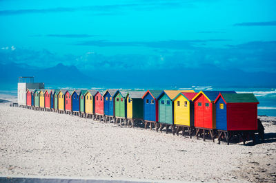 Low angle view of beach against blue sky