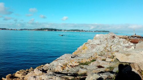 Scenic view of sea against blue sky