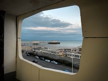 Panoramic view of sea seen through window