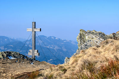 Scenic view of mountains against clear blue sky