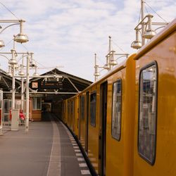 Train at railroad station against sky