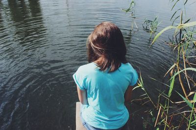 Woman standing by lake